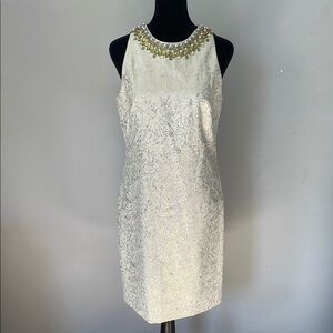 Elegant pale green Dress with Gold Accents and beaded neckline size 4 like new